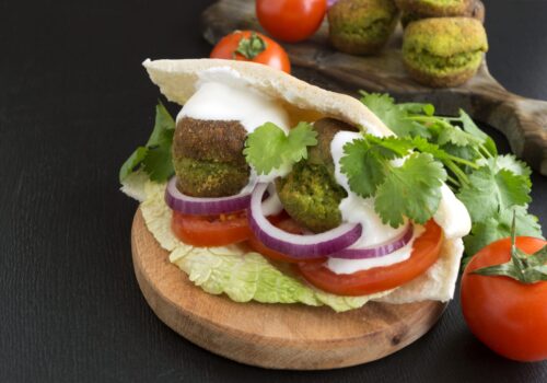 Falafel sandwich with pickles and tahini